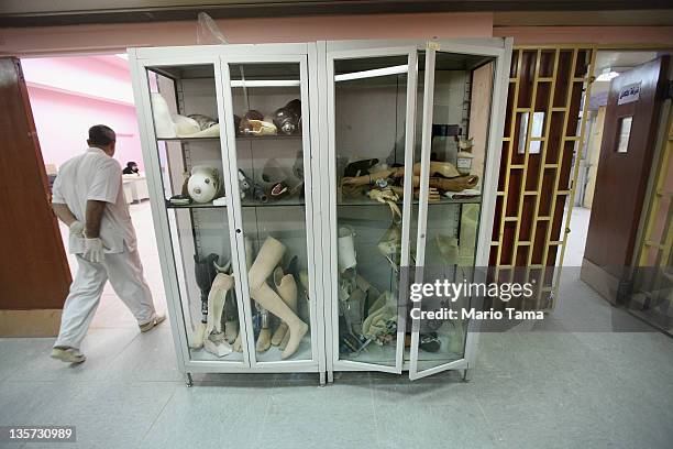 Technician walks through the Factory of Prosthetic Limbs on December 13, 2011 in Baghdad, Iraq. Wounded Iraqis face a shortage of the outdated...