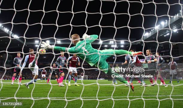 Ezri Konsa of Aston Villa scores their sides first goal past Kasper Schmeichel of Leicester City during the Premier League match between Aston Villa...