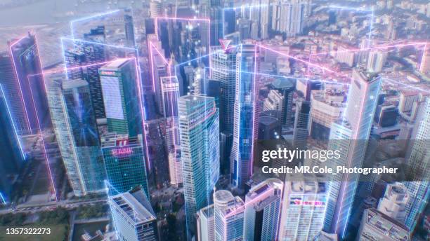 smart city  and metaverses concept,  motion futuristic neon light with aerial view modern cityscape - chain technology foto e immagini stock