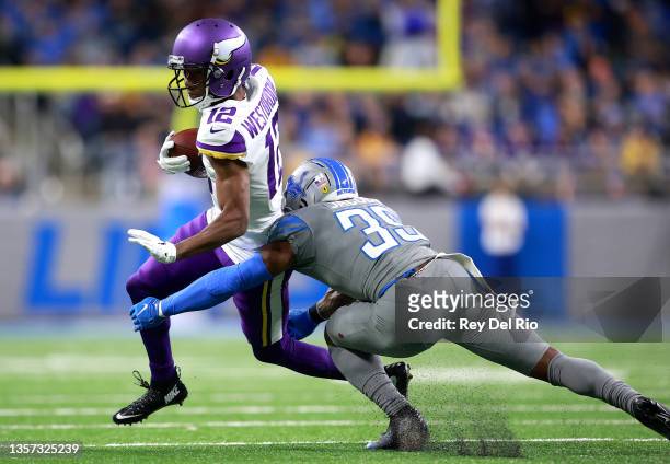 Dede Westbrook of the Minnesota Vikings runs the ball after a catch as Jerry Jacobs of the Detroit Lions looks to make the tackle during the first...