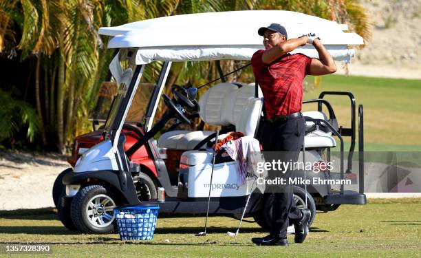 Tiger Woods of the United States hits balls on the range during the final round of the Hero World Challenge at Albany Golf Course on December 05,...