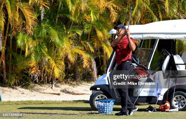 Tiger Woods of the United States hits balls on the range during the final round of the Hero World Challenge at Albany Golf Course on December 05,...