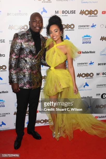 Hosts Eddie Kadi and Leigh-Anne Pinnock attend the MOBO Awards 2021 at The Coventry Building Society Arena on December 05, 2021 in Coventry, England.