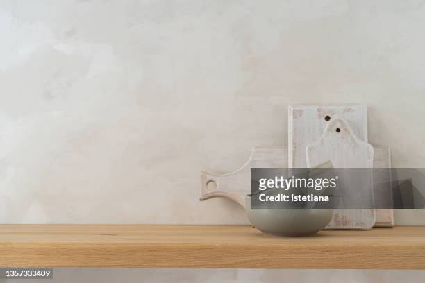 clean home environments. white wood cutting boards and ceramic bowls - ceramic green stock pictures, royalty-free photos & images