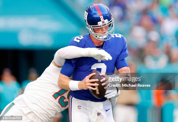 Jaelan Phillips of the Miami Dolphins sacks Mike Glennon of the New York Giants in the second half at Hard Rock Stadium on December 05, 2021 in Miami...