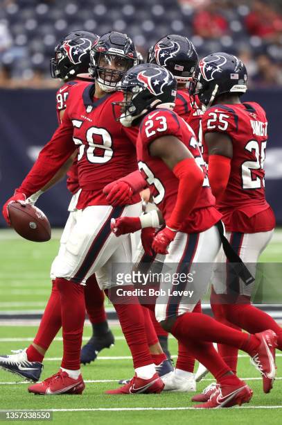 Christian Kirksey of the Houston Texans celebrates with teammates after recovering a fumble during the fourth quarter against the Indianapolis Colts...