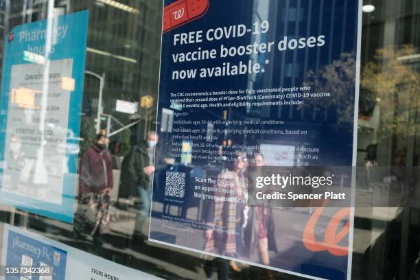 Walgreens pharmacy advertises Covid-19 booster shots in Times Square on December 05, 2021 in New York City. With the newly discovered omicron strain...