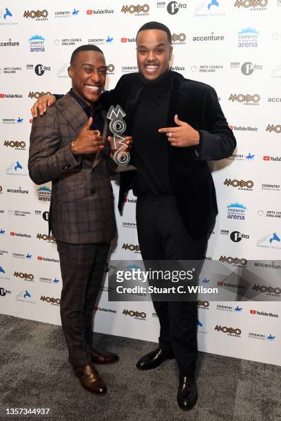Yung Filly and Chunkz pose with the 'Best Media Personality' award in the media room at the MOBO Awards 2021 at The Coventry Building Society Arena...