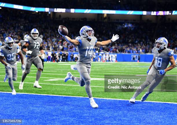 Amon-Ra St. Brown of the Detroit Lions celebrates after catching a touchdown as the time expired to defeat the Minnesota Vikings 29-27 at Ford Field...