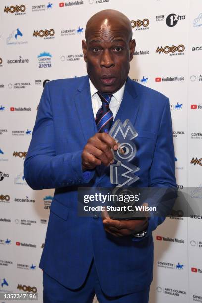 Frank Bruno poses with the ‘MOBO Inspiration’ award in the media room at the MOBO Awards 2021 at The Coventry Building Society Arena on December 05,...