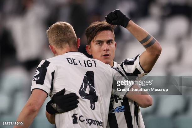 Paulo Dybala of Juventus celebrates with team mate Matthijs De Ligt after scoring to give the side a 2-0 lead during the Serie A match between...