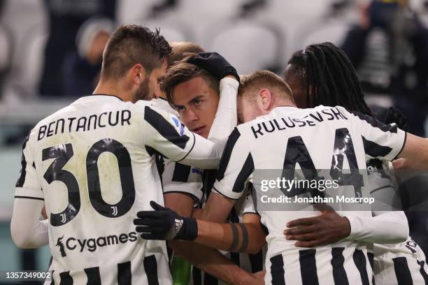 Paulo Dybala of Juventus celebrates with team mates after scoring to give the side a 2-0 lead during the Serie A match between Juventus v Genoa CFC...