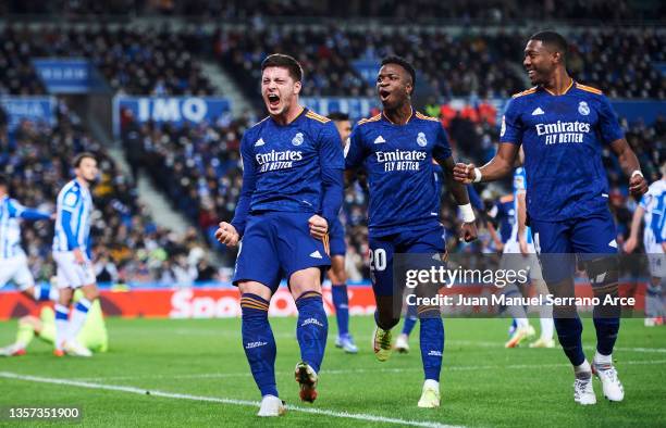 Luka Jovic of Real Madrid CF celebrates with his teammates Vinicius Junior and David Alaba of Real Madrid CF after scoring his team's second goal...