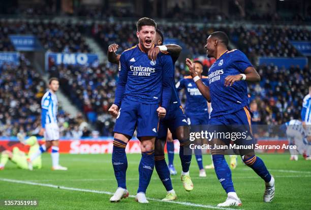 Luka Jovic of Real Madrid CF celebrates with his teammates Vinicius Junior and David Alaba of Real Madrid CF after scoring his team's second goal...