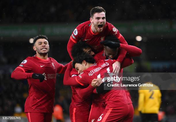 Divock Origi of Liverpool celebrates with Alex Oxlade-Chamberlain, Andrew Robertson, Trent Alexander-Arnold and Mohamed Salah after scoring their...