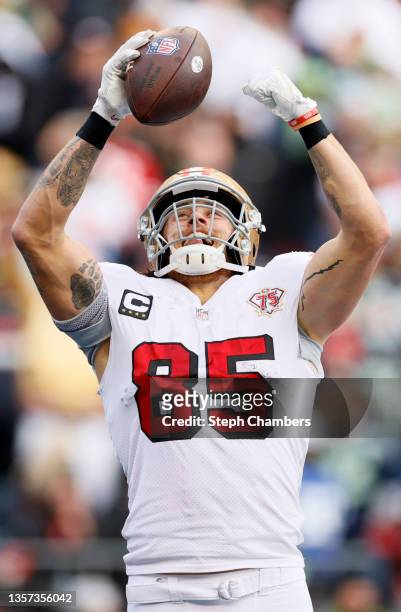 George Kittle of the San Francisco 49ers reacts after scoring a touchdown during the second quarter against the Seattle Seahawks at Lumen Field on...