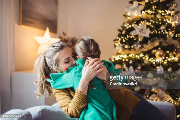 mothers love - christmas children stock pictures, royalty-free photos & images