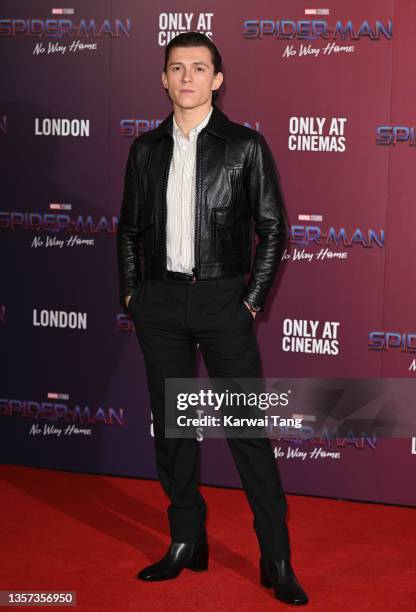 Tom Holland attends a photocall for "Spiderman: No Way Home" at The Old Sessions House on December 05, 2021 in London, England.