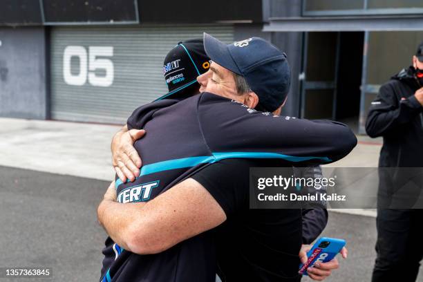 Bathurst 1000 winners Chaz Mostert and Lee Holdsworth are congratulated by Craig Lowndes during a Supercars media opportunity at Mount Panorama on...