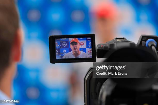 John Longmire, coach of the Swans, is seen on a screen of a video camera during a Sydney Swans AFL media conference at Lakeside Oval on December 06,...