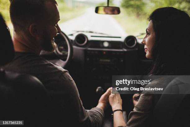 road car trip of young couple on honeymoon. view from the inside a car. - driving romance stock pictures, royalty-free photos & images