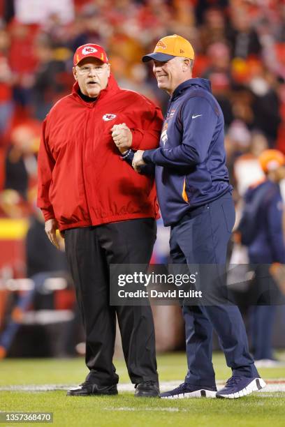 Head coach Andy Reid of the Kansas City Chiefs talks with offensive coordinator Pat Shurmur of the Denver Broncos before a game at Arrowhead Stadium...