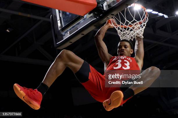 Ody Oguama of the Cincinnati Bearcats dunks the ball in the second half against the Bryant Bulldogs at Fifth Third Arena on December 05, 2021 in...