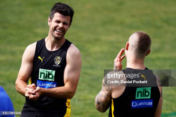 Trent Cotchin of the Tigers and Dustin Martin of the Tigers share a laugh during a Richmond Tigers AFL training session at Punt Road Oval on December...
