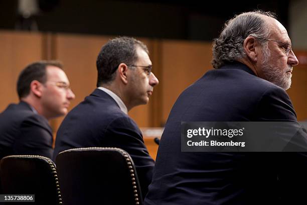 Jon S. Corzine, former chairman and chief executive officer of MF Global Holdings Ltd., right to left, Bradley Abelow, president and chief operating...