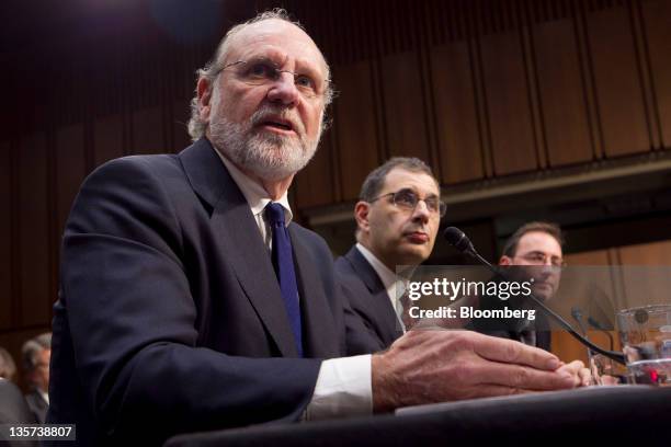 Jon S. Corzine, former chairman and chief executive officer of MF Global Holdings Ltd., left to right, Bradley Abelow, president and chief operating...