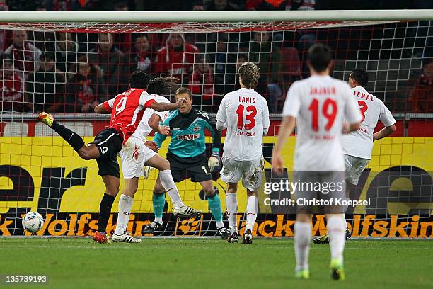 Sami Allagui of Mainz scores the first goal against Michael Rensing of Koeln during the Bundesliga match between 1. FC Koeln and FSV Mainz 05 at...