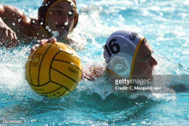 Jake Stone of the California Golden Bears looks to pass the ball against the USC Trojans during the Division I Men’s Water Polo Championship held at...