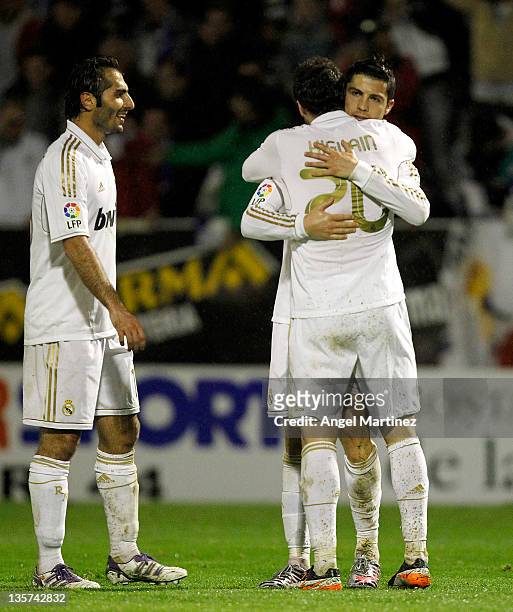 Cristiano Ronaldo of Real Madrid celebrates after scoring with Gonzalo Higuain and Hamit Altintop during the round of last 16 Copa del Rey first leg...