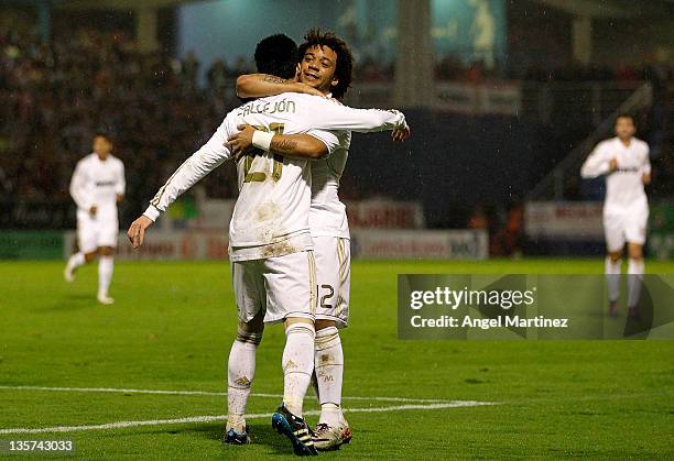 Jose Callejon of Real Madrid celebrates with Marcelo Vieira after scoring Real's opening goal during the round of last 16 Copa del Rey first leg...