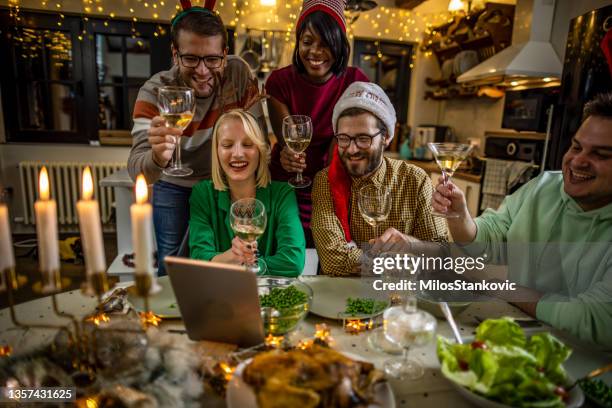 video call during new year's dinner party - zoom dinner stock pictures, royalty-free photos & images