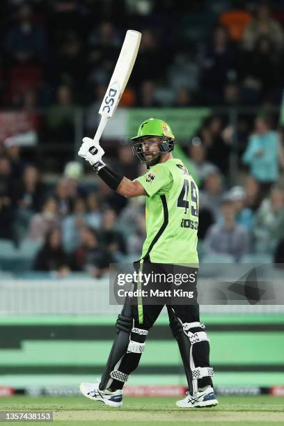 Alex Ross of the Thunder celebrates and acknowledges the crowd after scoring a half century during the Men's Big Bash League match between the Sydney...