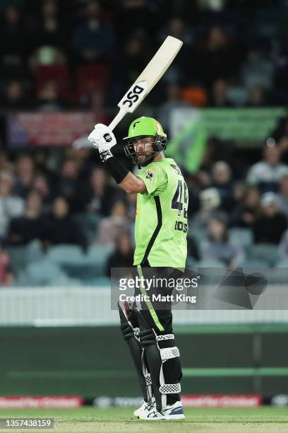 Alex Ross of the Thunder celebrates and acknowledges the crowd after scoring a half century during the Men's Big Bash League match between the Sydney...