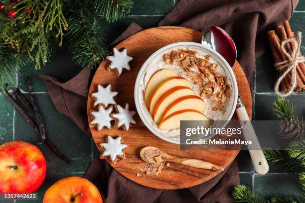 porridge bowl with baked apple dessert with cinnamon and nuts - winter breakfast stock pictures, royalty-free photos & images