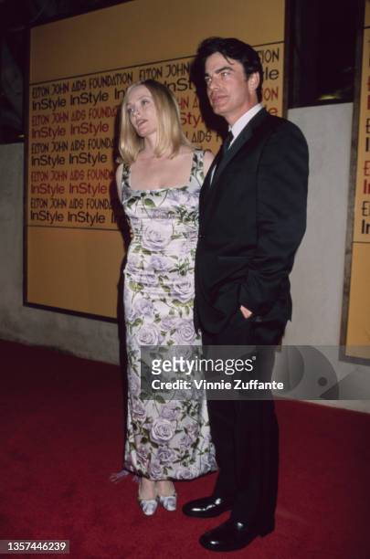 American actor Peter Gallagher and his wife, Paula Harwood, attend the Elton John AIDS Foundation and InStyle Oscar Party in Los Angeles, California,...