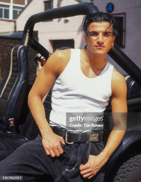 English-Australian singer Peter Andre, portrait wearing white vest, United Kingdom, circa 1995.