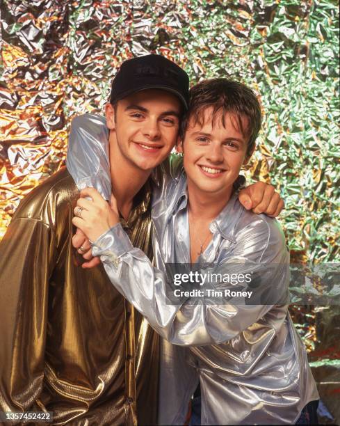 Ant & Dec , wearing silver and gold lame shirts, circa 1995.