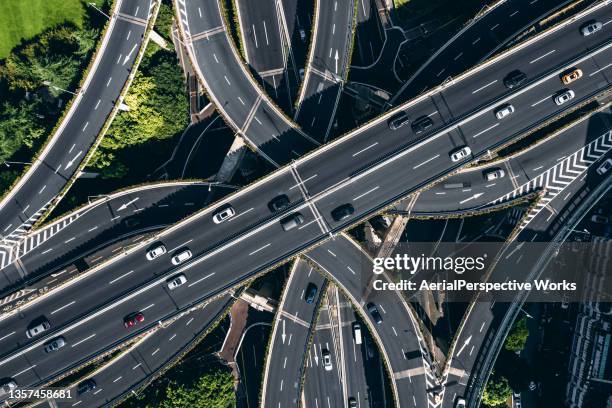 aerial view of busy road intersection - winding road stock pictures, royalty-free photos & images