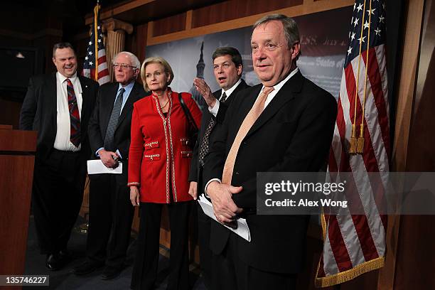 Sen. Jon Tester , Sen. Bernie Sanders , Sen. Claire McCaskill , Sen. Mark Begich , and Senate Majority Whip Sen. Richard Durbin participate in a news...