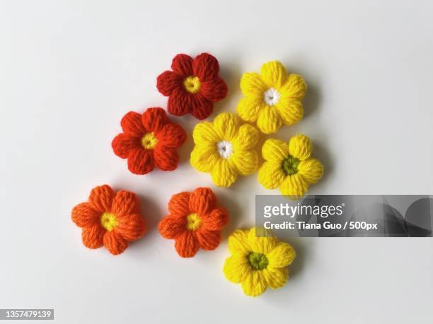 crochet flower,directly above shot of flowers on white background,jonesboro,arkansas,united states,usa - needlecraft product stock pictures, royalty-free photos & images