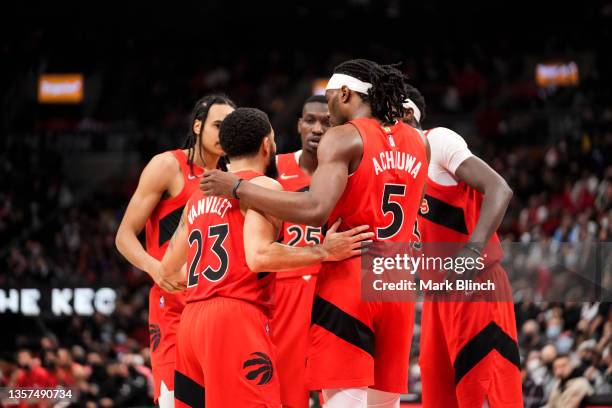 Fred VanVleet, Precious Achiuwa, Dalano Banton, Chris Boucher, and Pascal Siakam of the Toronto Raptors huddle in a break in play against the...