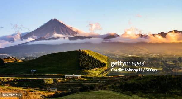 mt taranaki,scenic view of landscape against sky during sunset,new plymouth,new zealand - new plymouth stock pictures, royalty-free photos & images