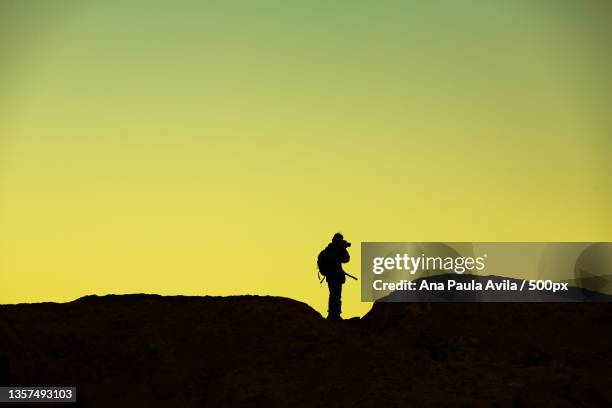 silhouette of man standing on mountain against clear sky during sunset - beton stairs stock pictures, royalty-free photos & images