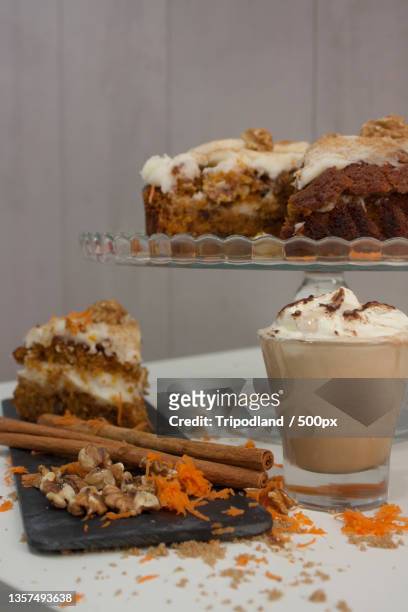 a piece of carrot cake with cappuccino,madrid,spain - zitruszeste stock-fotos und bilder