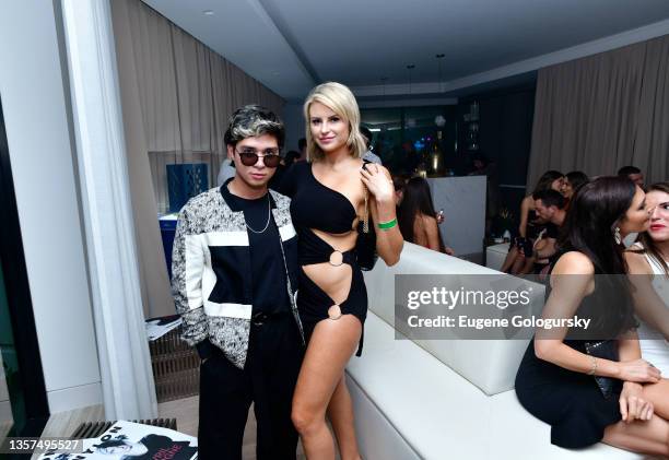 Guests attend as NYLON Celebrates Art, Music And Fashion At The NYLON House, Art Basel Miami on December 03, 2021 in Miami, Florida.