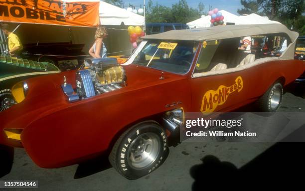 General view of the famous Monkeemobile, a modified Pontiac GTO, designed by George Barris during an auction circa 1983 in Los Angeles, California.
